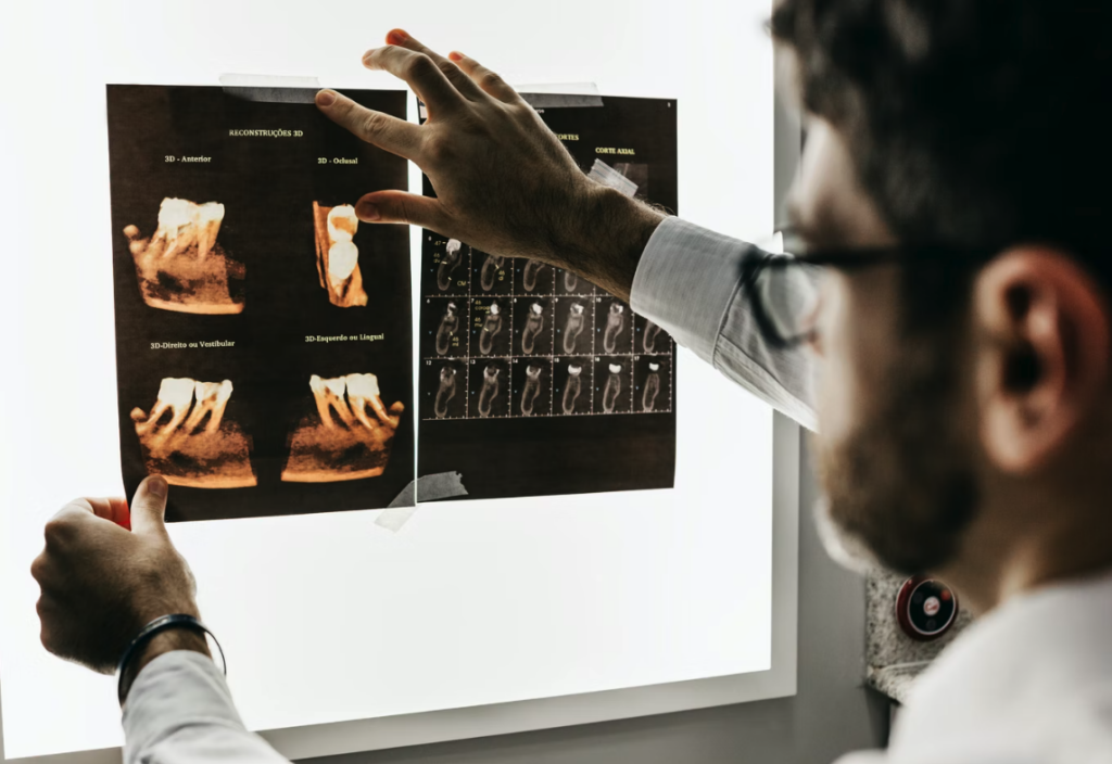 Dentist looking at teeth xray