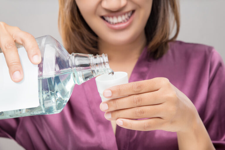 Woman Using Mouthwash After Brushing, Portrait Hands Pouring Mo