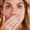 woman covering mouth