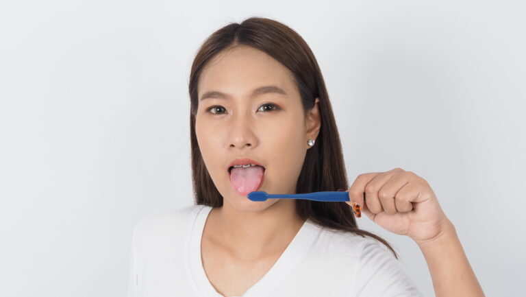 Girl Brushing her Tongue